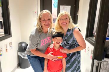 Ryan Gole is pictured here with his mother, Kristi (right), and his occupational therapist, Lisa (left).