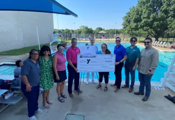People by the pool for the Pool Corp Check Presentation.