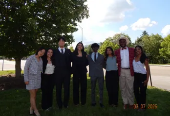 Group of students smiling at the CONA event 