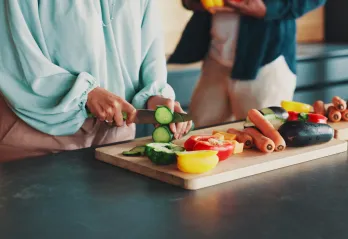 Person cutting vegetables