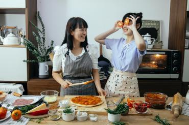 Asian Mom and Girl Cooking
