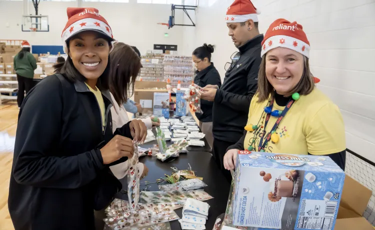 women packing boxes at christmas