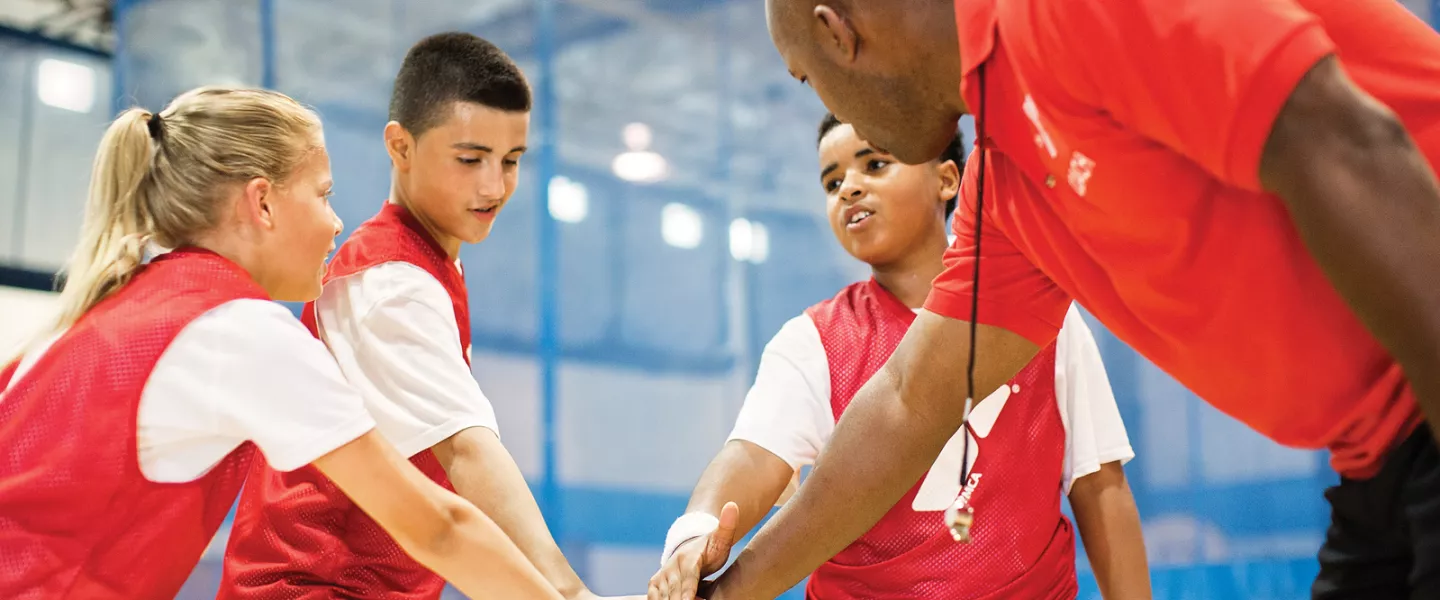 Basketball coach with kids