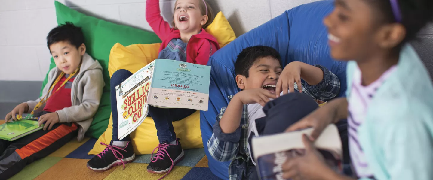 Kids laughing and reading