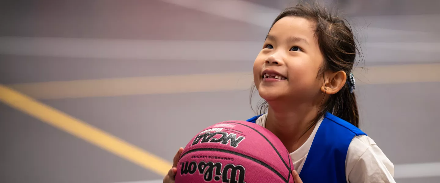 YMCA Youth Basketball member taking a shot