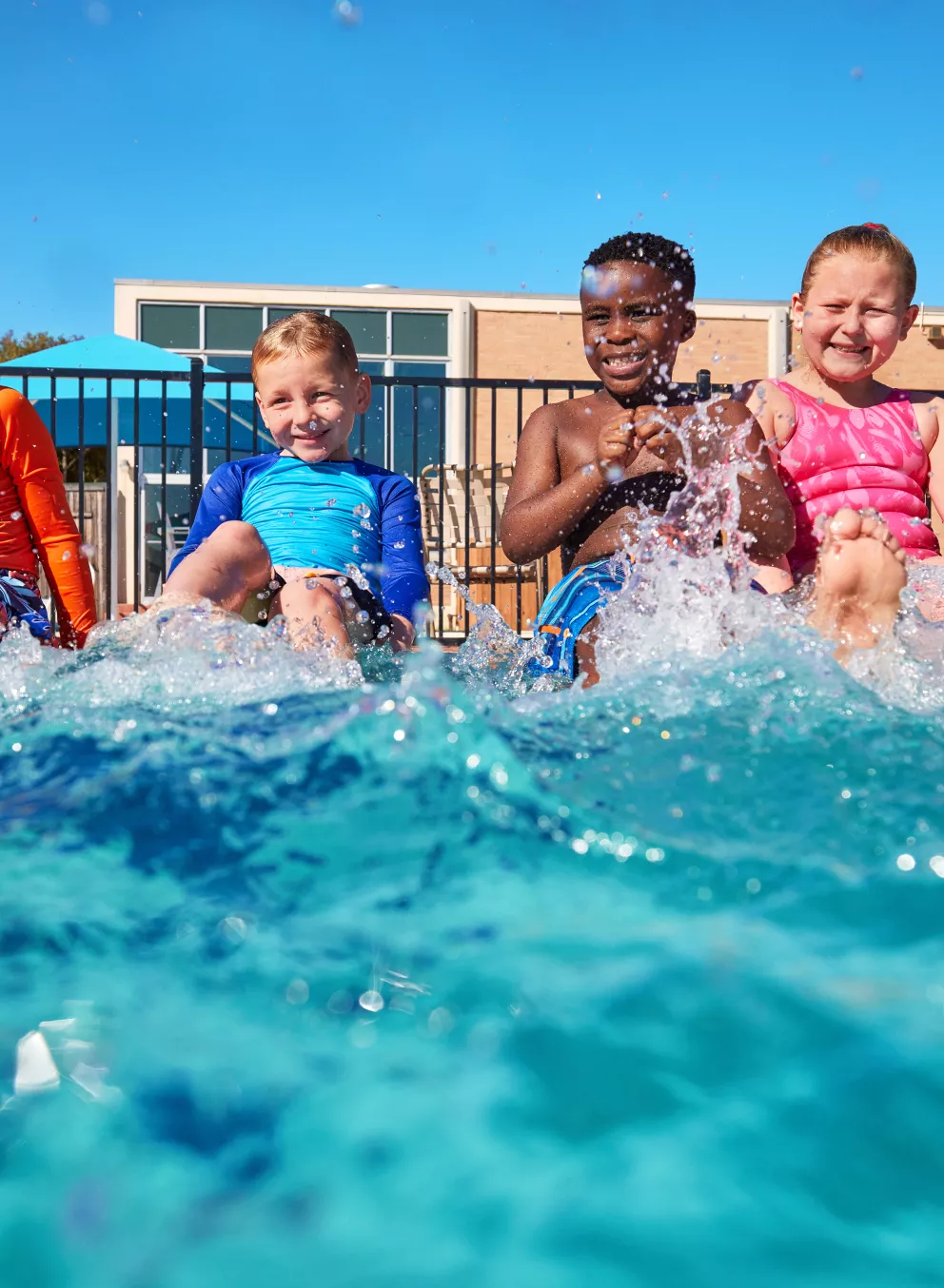 kids splashing in the pool
