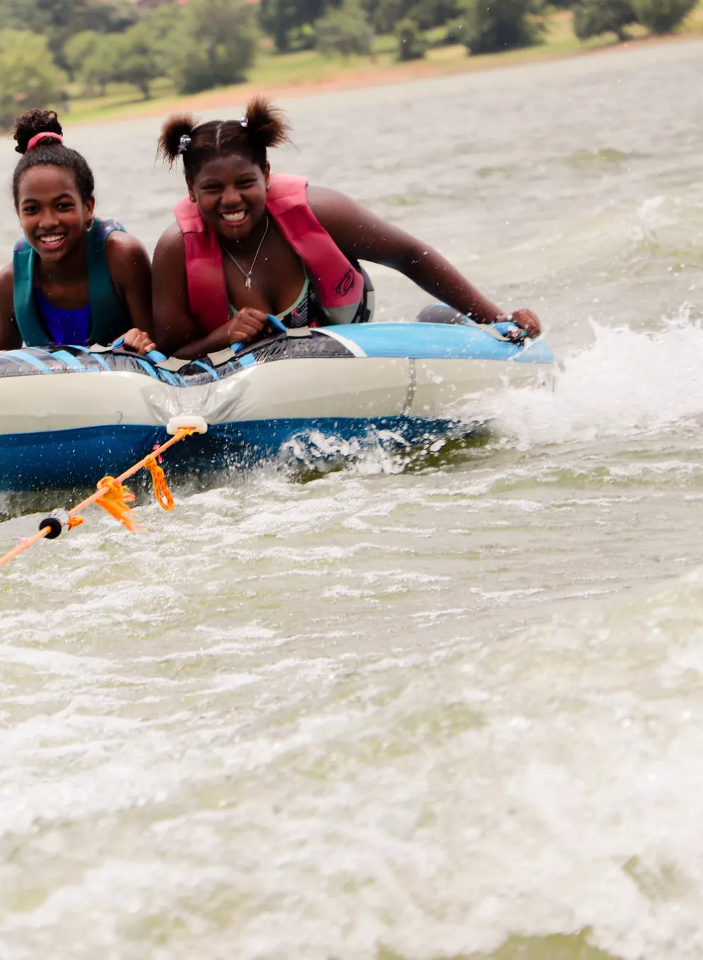 Two girls tubing on Lake Lewisville.