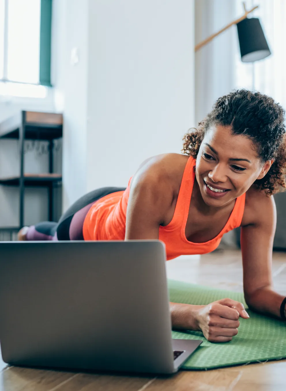 Women working out at home on computer
