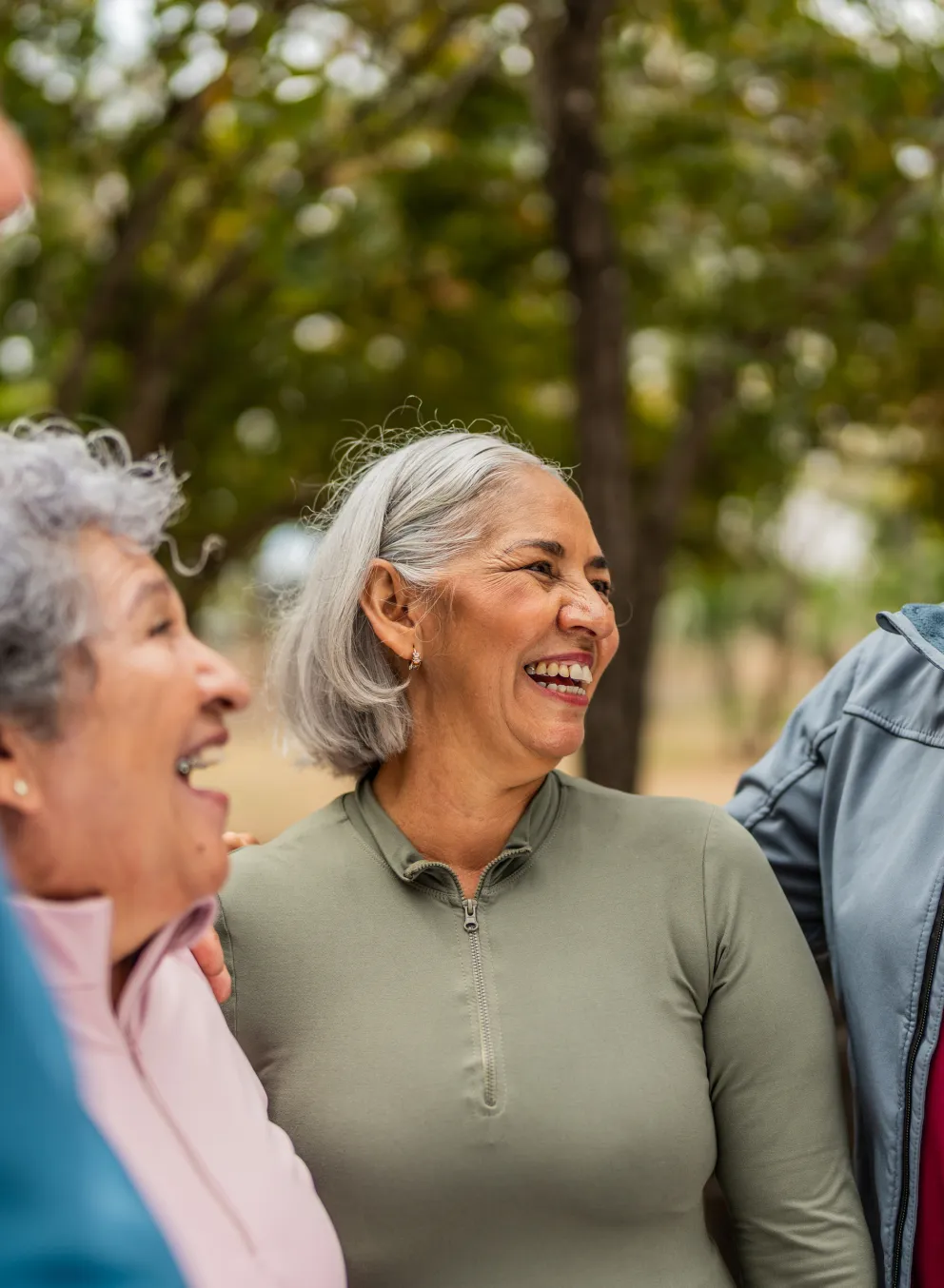 A group of active older adults, outdoors and laughing