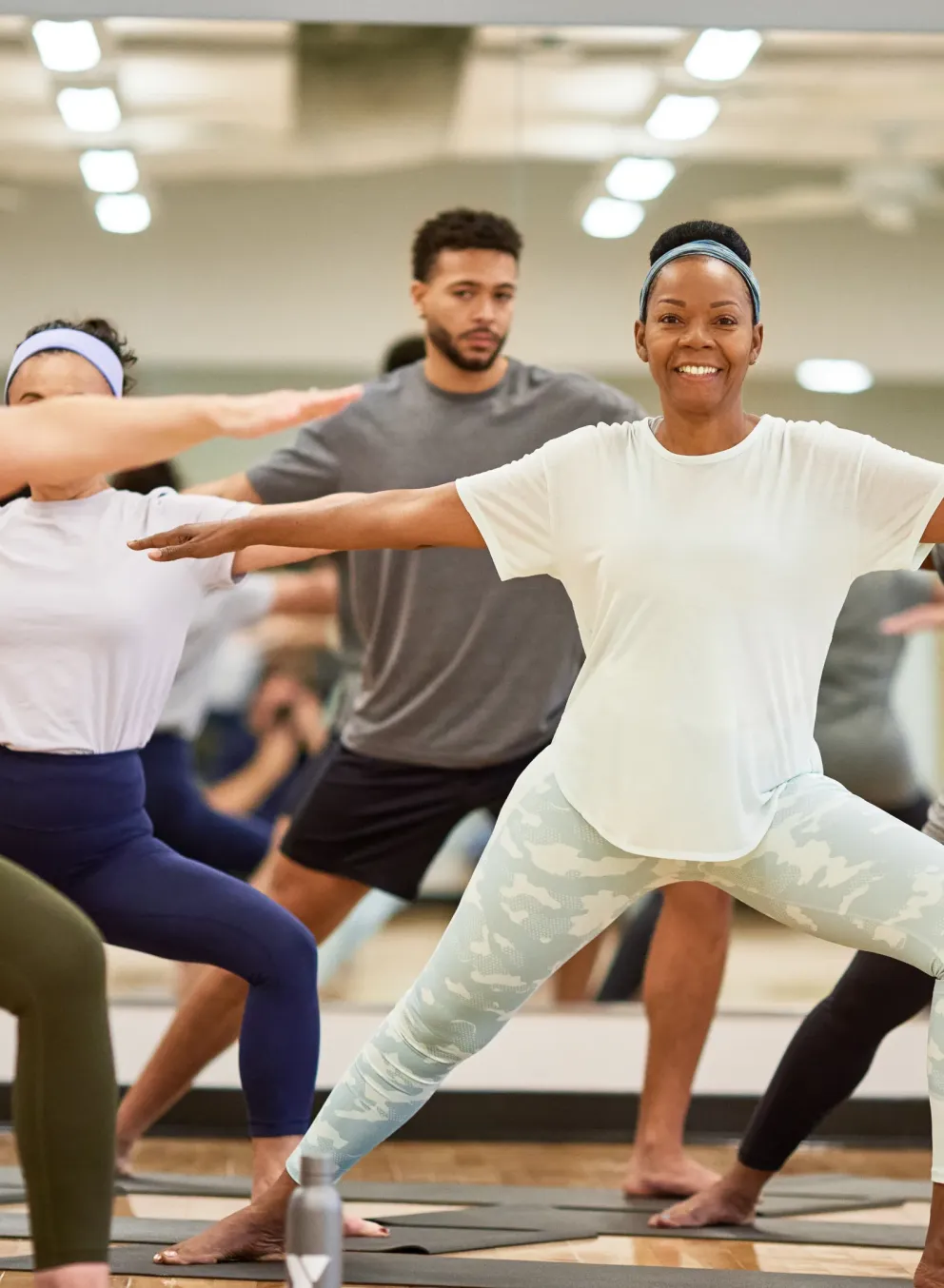 People doing yoga with a ymca instructor