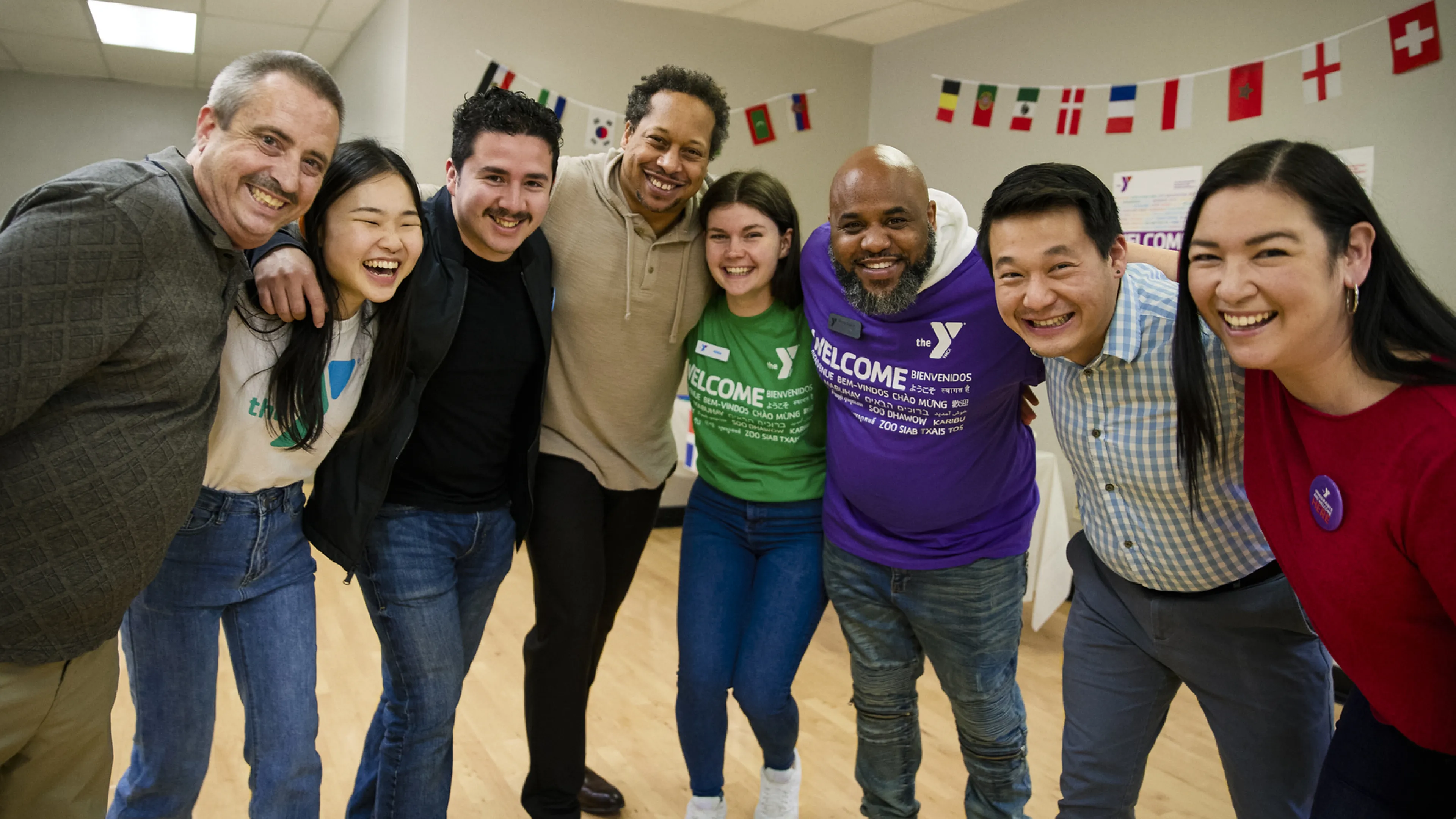 multicultural staff together smiling