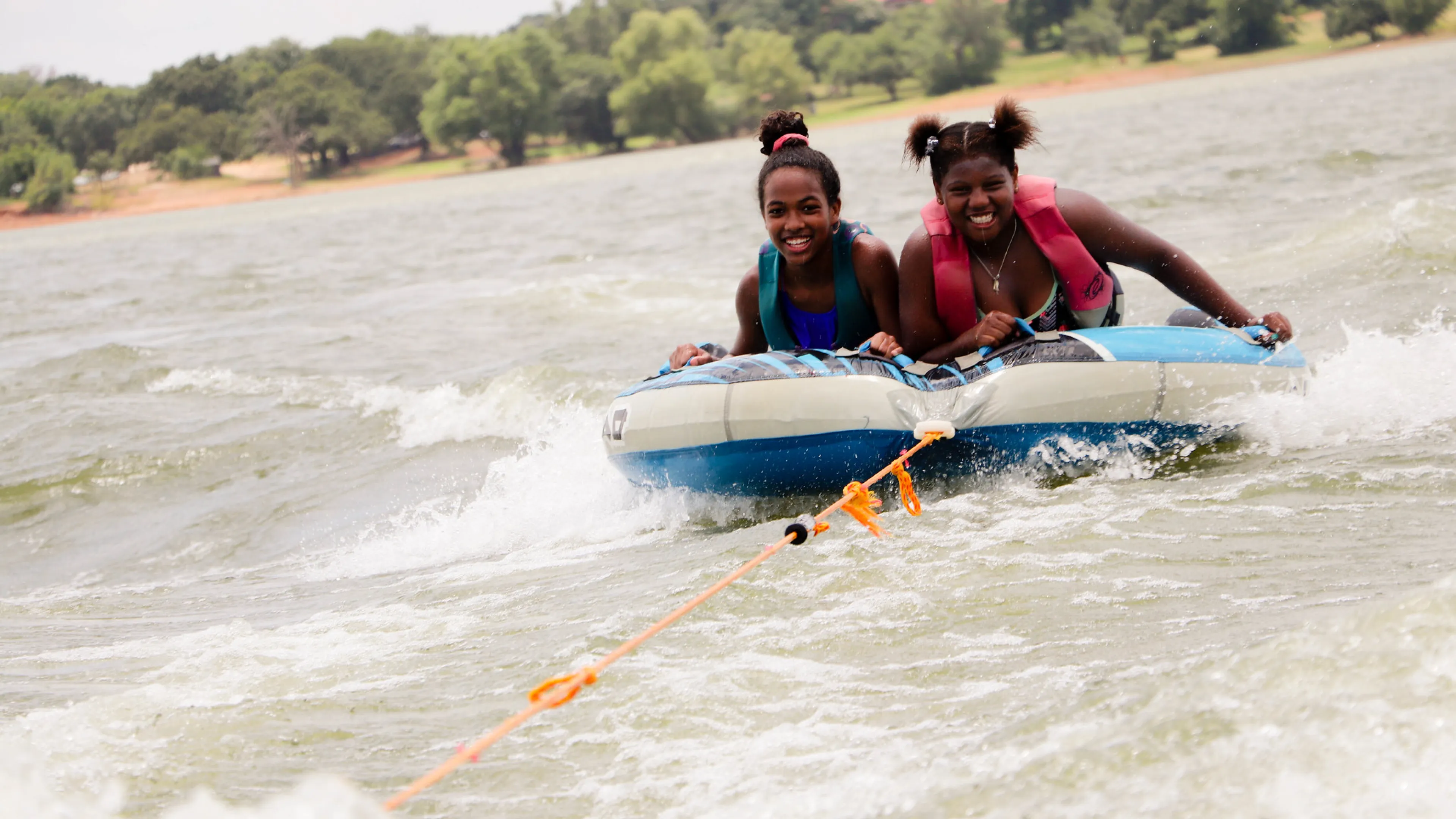 Two girls tubing on Lake Lewisville.