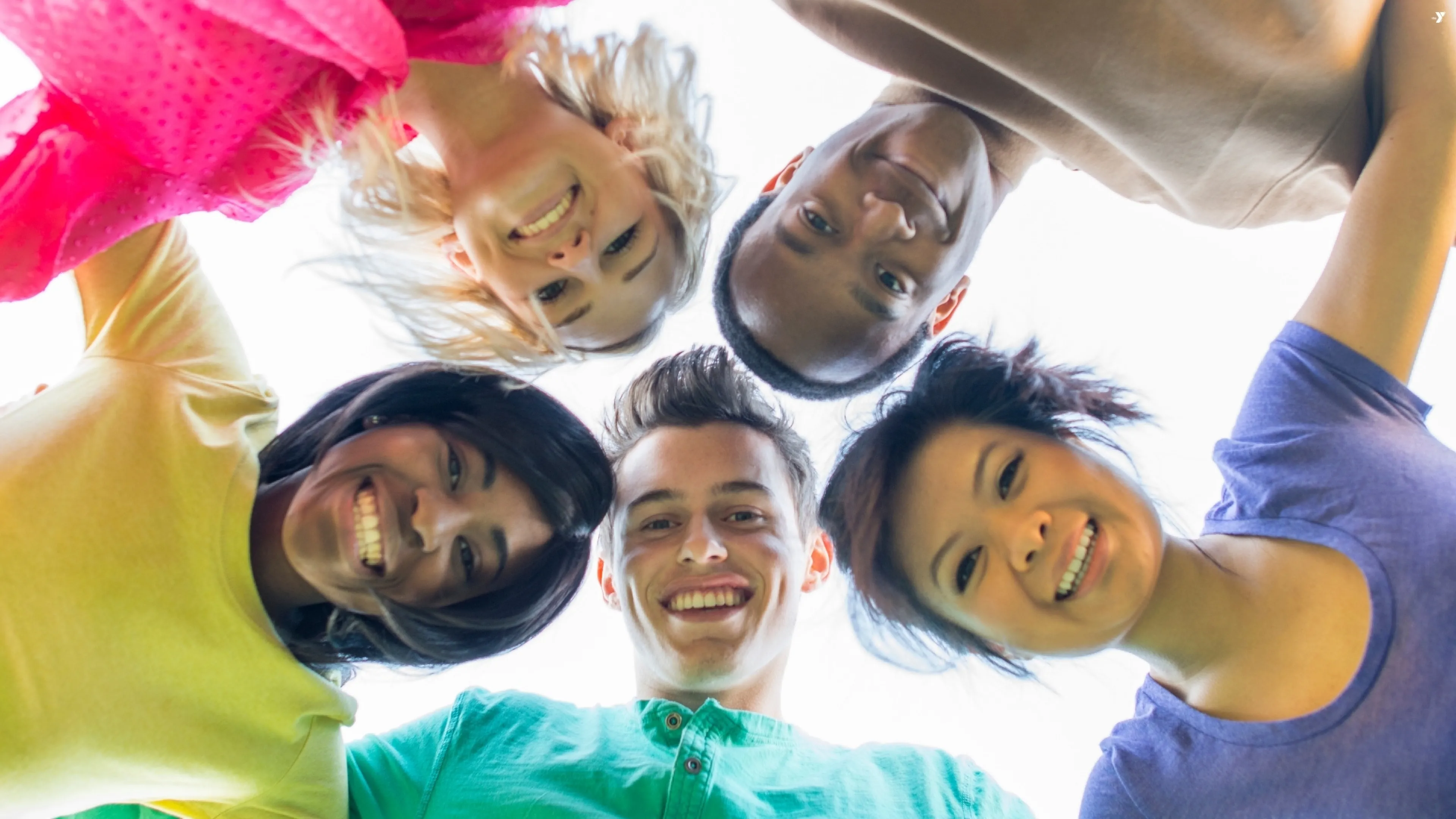 People putting their heads together in a circle