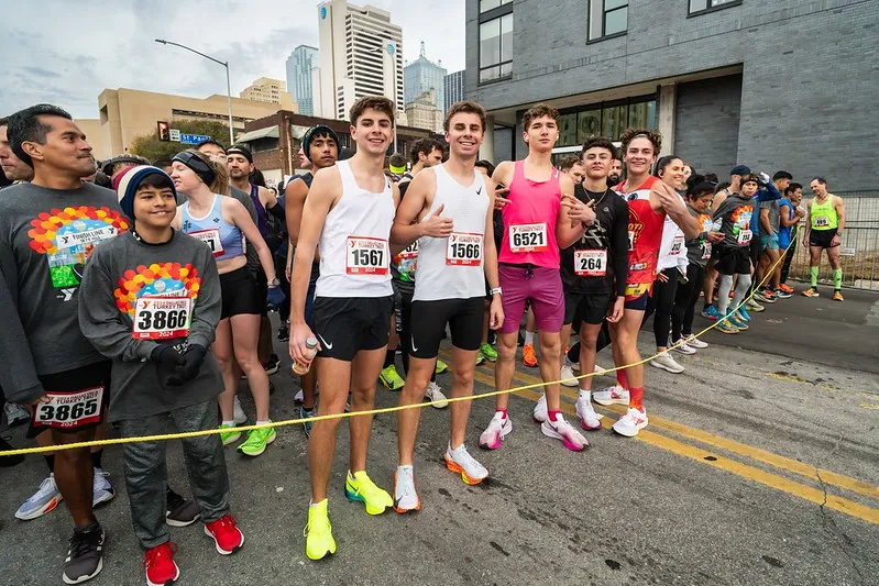 Runners posing at the start line for a quick photo before the race