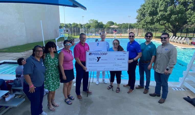 People by the pool for the Pool Corp Check Presentation.