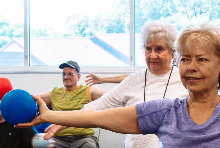 Active Older Adults working out in a group exercise class