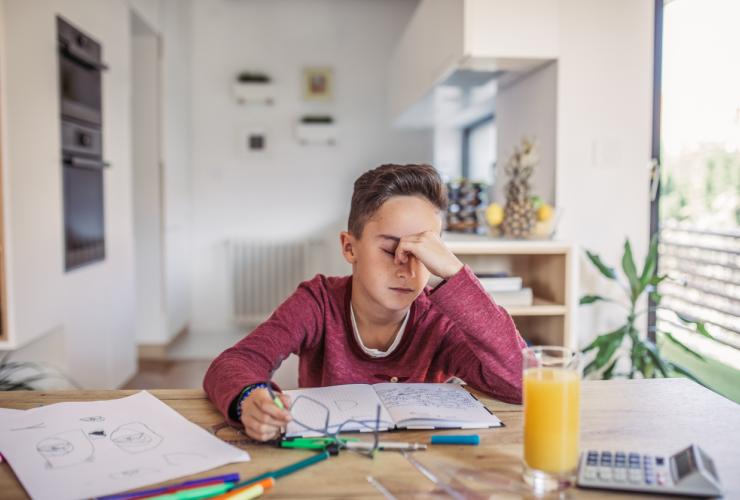 Boy tired of doing math bored