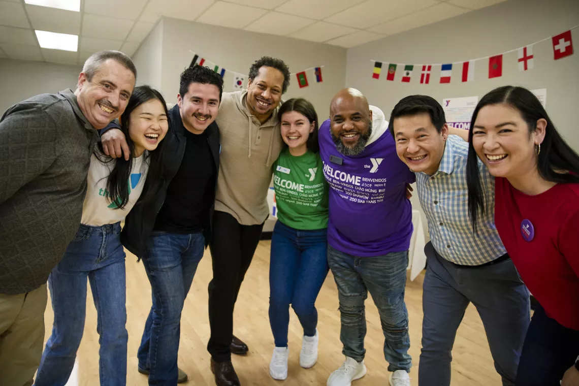 multicultural staff together smiling