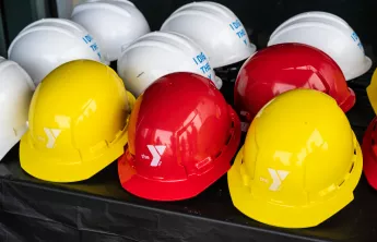 Hard Hats with Y Logos on them