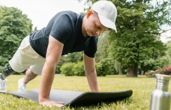 Man doing a pushup outside