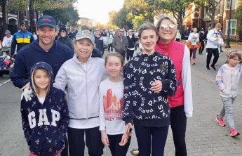 Photo of Jane, her family, and mother at Turkey Trot