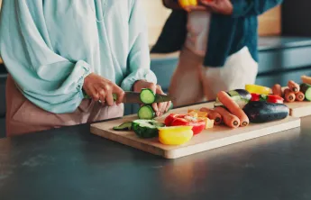Person cutting vegetables