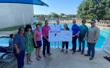 People by the pool for the Pool Corp Check Presentation.