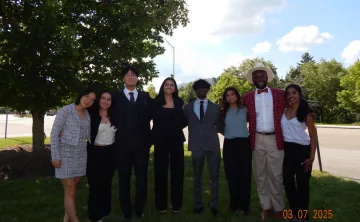 Group of students smiling at the CONA event