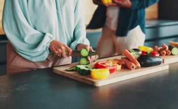 Person cutting vegetables